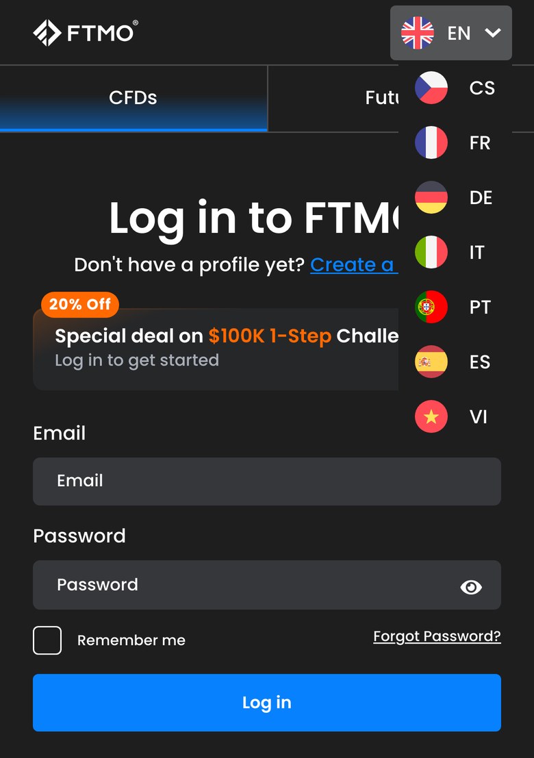 FTMOのログイン画面で言語のメニューを開いたところ（スマホ表示）。EN、CS、FR、DE、IT、PT、ES、VIの8つが並び、日本語は無い。画面の文言は英語で、Log in to FTMO、Email、Passwordと表示されている